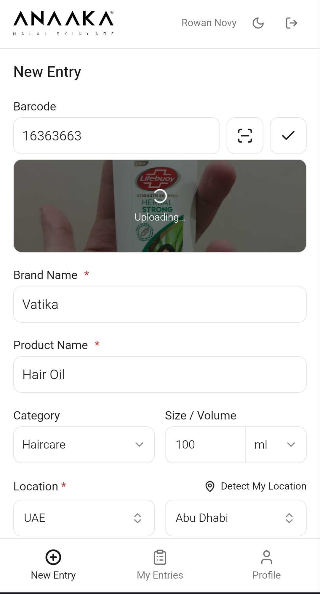 Mobile camera scan — product photo captured (Lifebuoy shampoo), uploading to entry; barcode pre-filled from scan